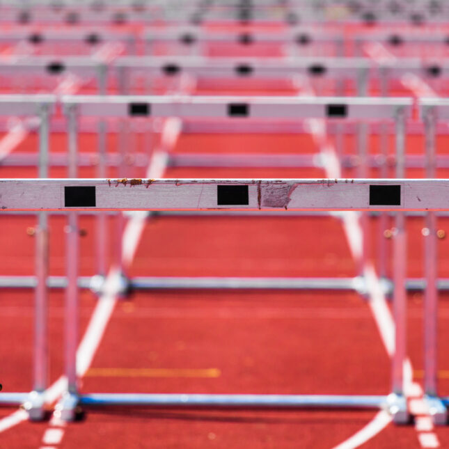 Stock photo of hurdles set up on a track – opinion coverage from STAT
