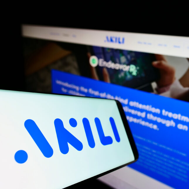 a phone screen displays Akili Interactive's logo – health tech coverage from STAT