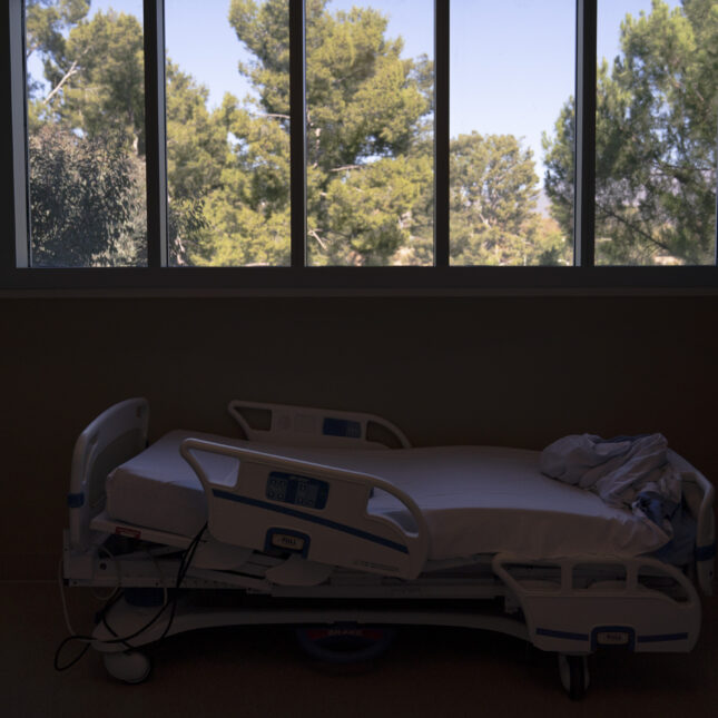 A hospital bed is seen in a COVID-19 unit at Providence Holy Cross Medical Center in the Mission Hills section of Los Angeles, Nov. 19, 2020. Roughly 84 million people are covered by Medicaid, the government-sponsored program that's grown by 20 million people since January 2020, just before the coronavirus pandemic hit. Now, as states begin checking everyone’s eligibility for Medicaid for the first time in three years, as many as 14 million people could lose access to that coverage. – politics and policy coverage from STAT