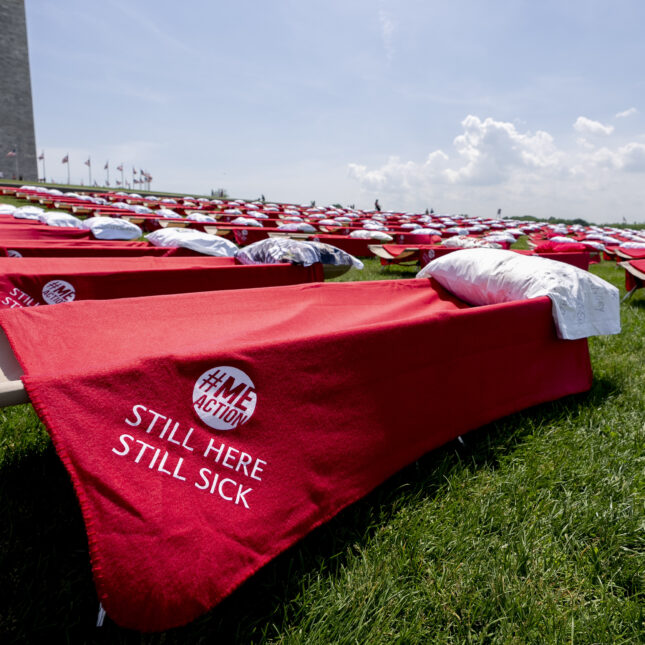 Advocates for people suffering from long COVID-19 and myalgic encephalomyelitis/chronic fatigue syndrome host an installation of 300 cots in front of the Washington Monument on the National Mall in Washington, Friday, May 12, 2023, to represent the millions of people suffering from post-infectious disease.