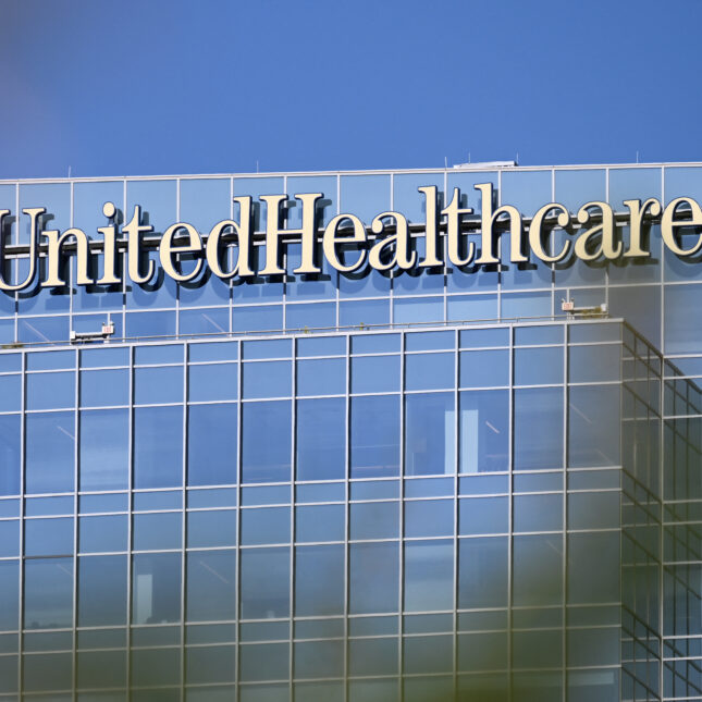 UnitedHealthcare (UHC) health insurance company signage is displayed on an office building in Phoenix, Arizona